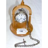 A Winegartens railway regulator pocket watch with chain on stand