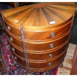 A half round antique style multi chest of drawers, standing on carved supports - 66cm