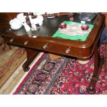 A 19th century mahogany library table with two drawers to the apron and leather top