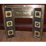 A decorative Victorian brass and tile fire surround with Adam swag relief work - 107cm wide x