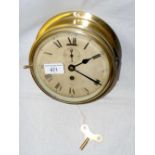 A Smith's brass ship's bulk head clock with separate secondhand - 17cm diameter