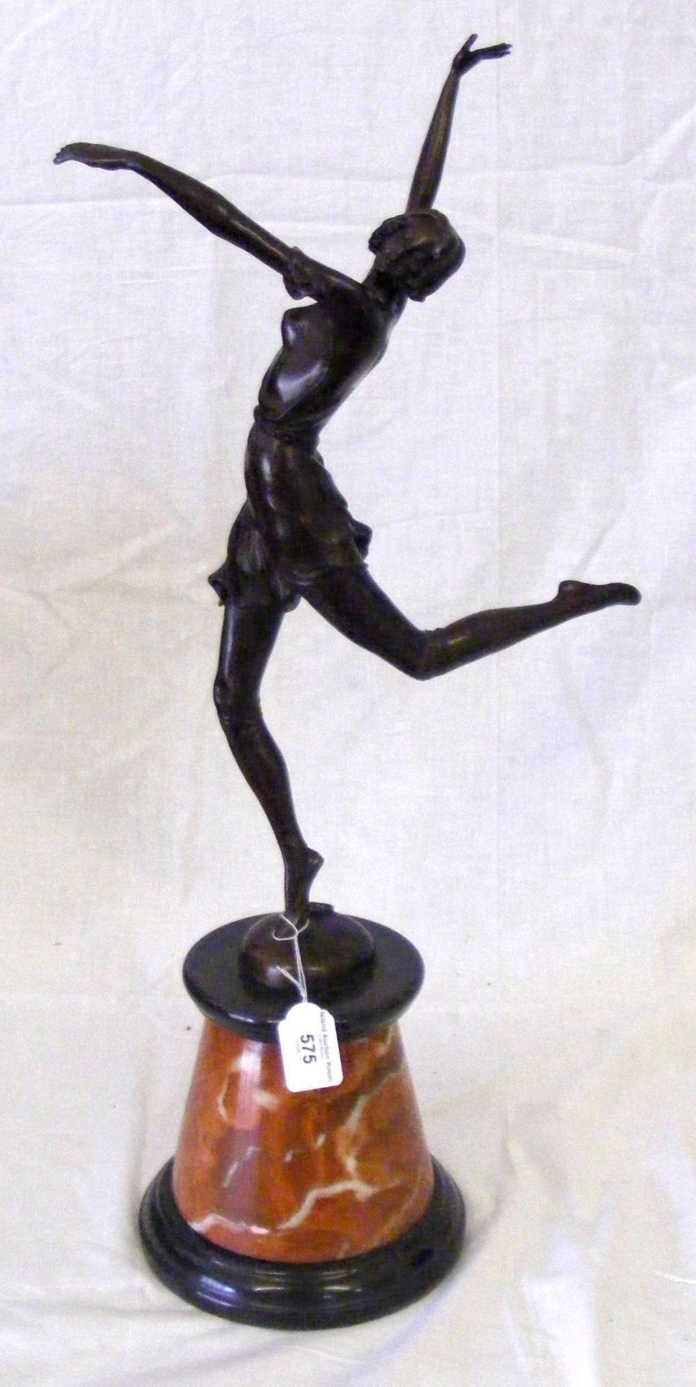 A 49cm bronze figure of an art deco dancing lady on marble plinth