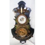A ship's clock/aneroid barometer with carved wood rope twist and anchor frame