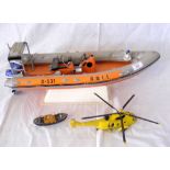 A plastic model of the RNLI Rescue Rib B-531 - 56cm, together with a Rescue Helicopter and a model