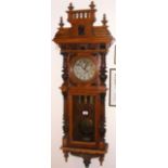 A 19th century Grande Sonnerie Vienna regulator wall clock with engraved brass weights to the