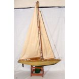 A 76cm wooden pond yacht complete with sails and rigging