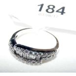 An 18ct white gold baguette and brilliant cut diamond half hoop eternity ring - .6 carat