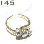 A three stone diamond ring in 18ct gold setting