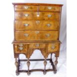 A Georgian walnut chest on stand having cross-banded drawer fronts and brass escutcheons - 160cm