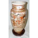 A 32cm Japanese Satsuma vase with domestic scene decoration on wooden base