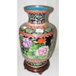 A Chinese cloisonne vase with flower and bird decoration on wooden base - 44cm high overall