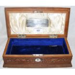 A 28cm ornately carved Indian sandalwood box with hinged lid, inscribed on plaque to the interior "