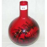 A 26cm high Royal Doulton "flambe" bottle vase with horse drawn carriage scene to the bowl