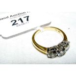 An 18ct yellow gold three stone diamond ring