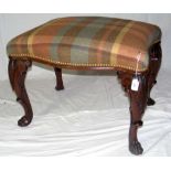 An antique Irish mahogany stool with carved cabriole supports and paw feet - 60cm x 48cm high