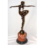 An Art Deco style bronze figure of a dancer on globe - on marble base - 56cm high overall