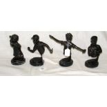A set of four bronze busts of American baseball players on matching oval marble bases