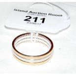 An 18ct three coloured gold half hoop diamond eternity ring