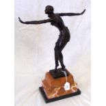 A 36cm high bronze art deco figure of a dancing lady on stepped marble plinth
