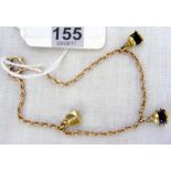 A 9ct gold charm bracelet mounted with 18ct port, starboard and masthead light charms