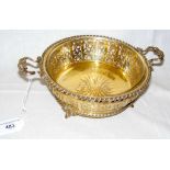 An embossed and pierced silver gilt presentation bowl with glass liner - 19cm diameter -