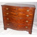 A Georgian mahogany serpentine chest of four long graduated drawers, with string inlay to the drawer