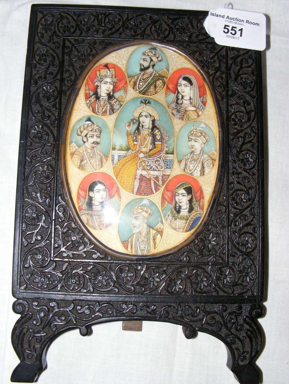 A group of nine finely painted Indian miniature portrait paintings in oval setting on carved easel