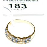 An 18ct yellow gold sapphire and diamond half hoop eternity ring