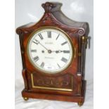 A Regency mahogany bracket clock by Lelli of Newport, Isle of Wight having brass inlay and twin