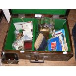 Wooden box containing various collectables, including coins, ephemera