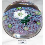 A Paul Ysart paperweight with white flower and "H" cane