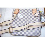 A Louis Vuitton shoulder bag with cream and blue check design and shoulder strap (new)