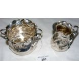 A Schiebler Japonesque sterling silver cream jug and matching sugar bowl impressed L.O.W. with