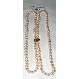 Double strand pearl necklace with 585 marked gold and diamond clasp