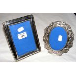 A silver photo frame, together with one other