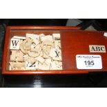 A quantity of Victorian ivory/bone letters in box