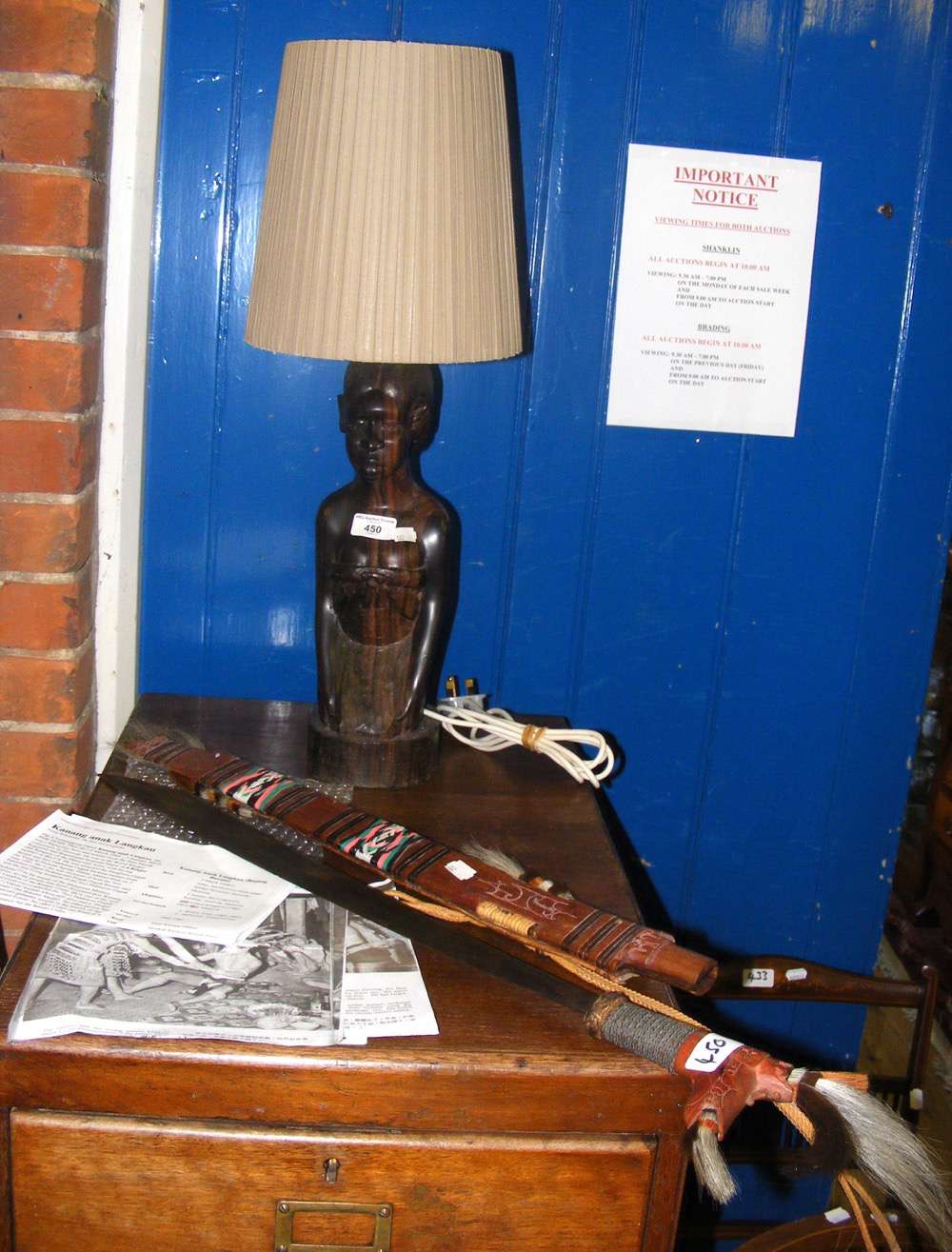 An unusual Malaysian sword with decoration, together with a carved African wooden table lamp