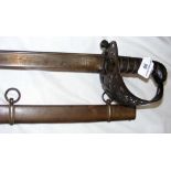 Antique Cavalry Officer's sword with curved blade and pierced hand guard, having metal scabbard -