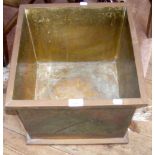 A square brass planter/log bin