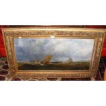 A 19th century oil on canvas of shipping in rough seas in decorative gilt frame - 42cm x 90cm