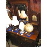 An Edwardian mirrored back sideboard with drawers and cupboards below