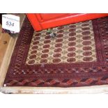 A Middle Eastern style carpet with geometric border and centre medallion - 270cm x 185cm