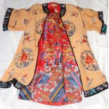 An old Chinese embroidered coat with dragon five claw design