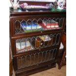 A Globe Wernicke three section bookcase with lead glazed front and drawer below