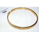 Engine turned 9ct gold bangle