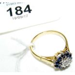 An 18ct yellow gold diamond and sapphire cluster ring