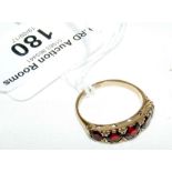 A 9ct yellow gold garnet dress ring