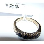 A 9ct gold sapphire and diamond half hoop eternity ring
