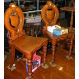 A pair of Victorian hall chairs