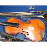 An old violin and bow in carrying case